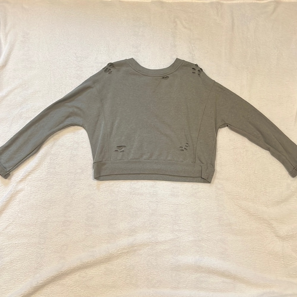 Cropped, long sleeve ripped shirt